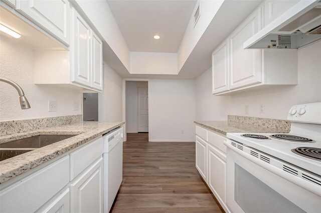 2400 N Braeswood Blvd Unit 106, Houston, TX 77030 - kitchen with white appliances, under cabinet range hood, a sink, wood finished floors, and white cabinets