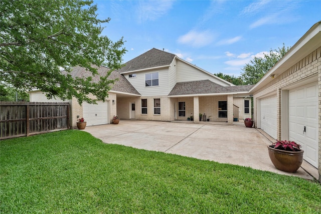 3707 Doyle Ct, Missouri City, TX 77459 - back of house with roof with shingles, brick siding, an attached garage, and driveway