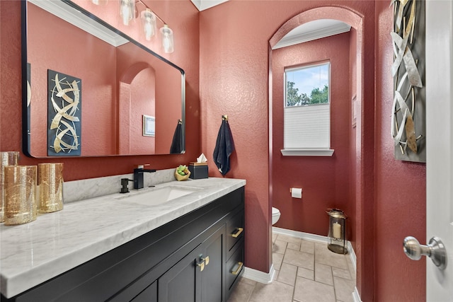 3707 Doyle Ct, Missouri City, TX 77459 - bathroom featuring baseboards, vanity, toilet, a textured wall, and ornamental molding