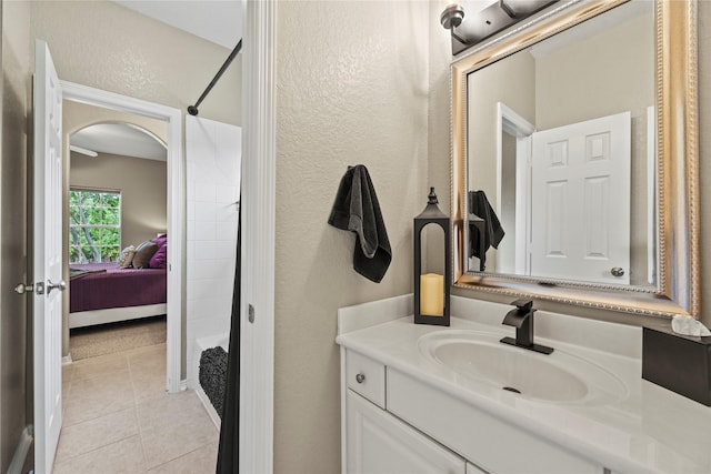 3707 Doyle Ct, Missouri City, TX 77459 - bathroom featuring a textured wall, vanity, tile patterned flooring, and connected bathroom