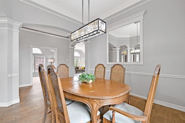 408 Pine Creek Dr, Friendswood, TX 77546 - dining area with decorative columns, baseboards, wood finished floors, and crown molding