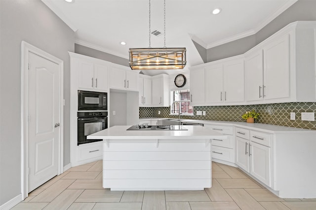 408 Pine Creek Dr, Friendswood, TX 77546 - kitchen with black appliances, crown molding, white cabinetry, light countertops, and backsplash