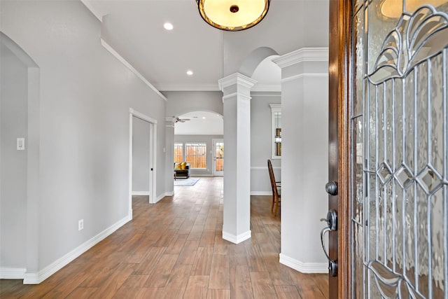 408 Pine Creek Dr, Friendswood, TX 77546 - entrance foyer featuring ornate columns, arched walkways, a ceiling fan, baseboards, and wood finished floors