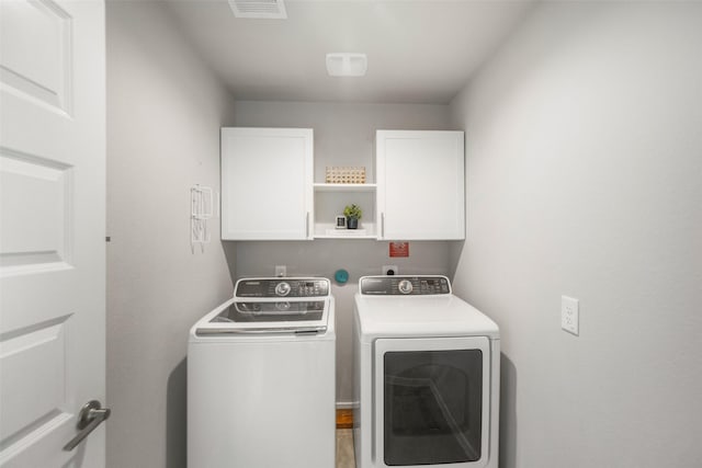 29419 Georgia Throw Ln, Katy, TX 77494 - washroom featuring cabinet space and separate washer and dryer