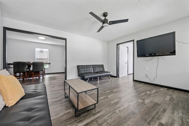 541 Trails End Dr, Cleveland, TX 77328 - living room featuring ceiling fan, wood finished floors, a textured ceiling, and baseboards