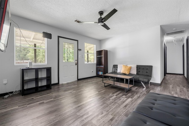 541 Trails End Dr, Cleveland, TX 77328 - living room with ceiling fan, wood finished floors, a textured ceiling, and baseboards