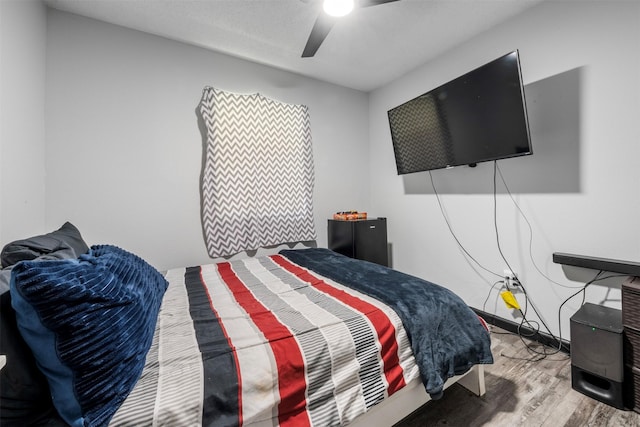 541 Trails End Dr, Cleveland, TX 77328 - bedroom with wood finished floors and ceiling fan
