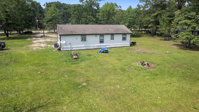 541 Trails End Dr, Cleveland, TX 77328 - rear view of property with central AC and a yard
