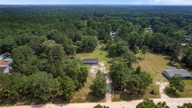 541 Trails End Dr, Cleveland, TX 77328 - aerial overview of property's location with a forest