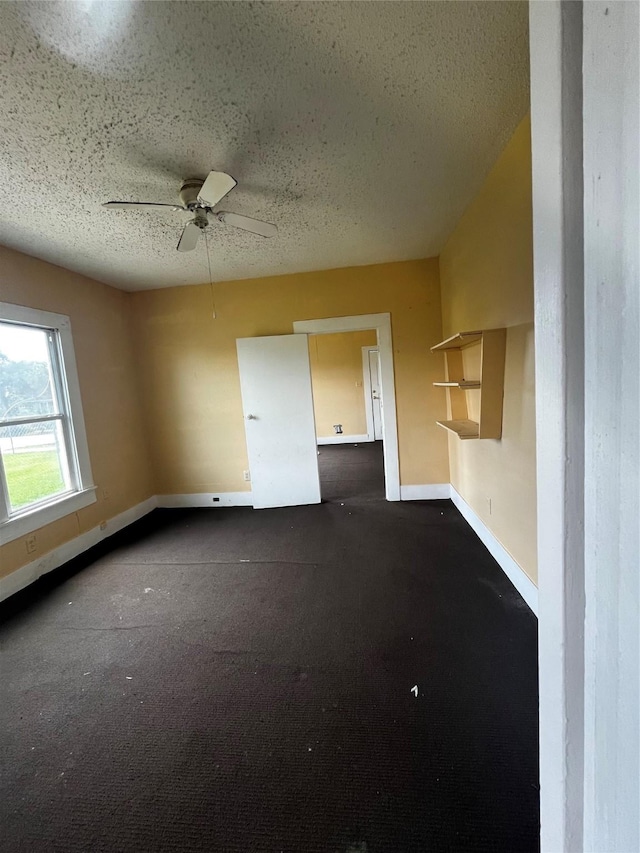 6015 Brady St, Houston, TX 77011 - unfurnished room with a textured ceiling, baseboards, and ceiling fan