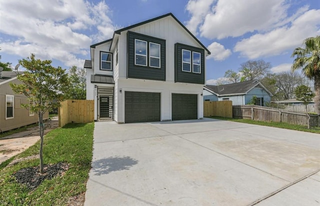 6732 Goforth, Houston, TX 77021 - view of front of house featuring an attached garage, concrete driveway, and a gate