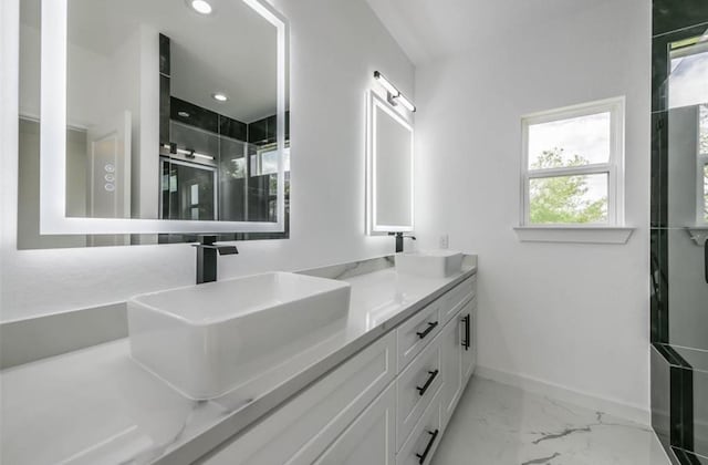 6732 Goforth, Houston, TX 77021 - full bath featuring baseboards, double vanity, marble look tile flooring, a shower with shower door, and recessed lighting