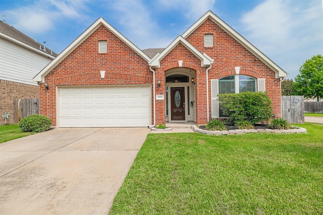 2630 Sable Ridge Ln, Katy, TX 77494 - traditional home with brick siding, concrete driveway, and a garage