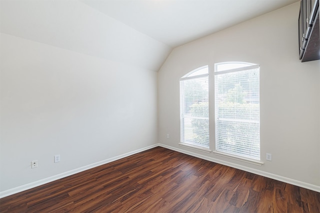 2630 Sable Ridge Ln, Katy, TX 77494 - spare room with dark wood-style floors, baseboards, and lofted ceiling