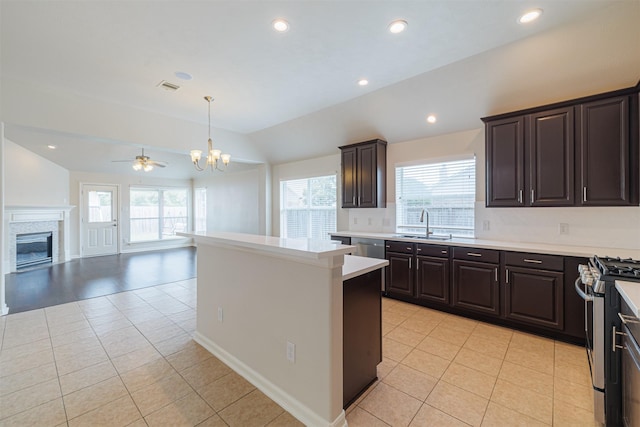 2630 Sable Ridge Ln, Katy, TX 77494 - kitchen with vaulted ceiling, a chandelier, light tile patterned flooring, a sink, and healthy amount of natural light