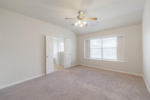 2630 Sable Ridge Ln, Katy, TX 77494 - unfurnished bedroom with lofted ceiling, light carpet, baseboards, and ceiling fan