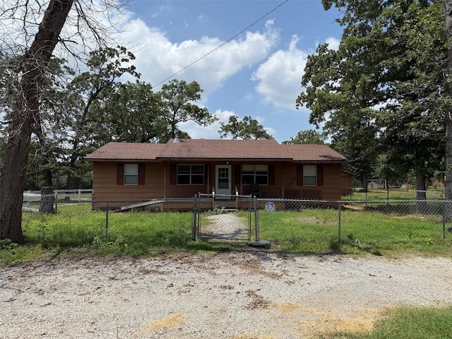 7719 County Road 233, Centerville, TX 75833 - single story home with covered porch and a gate