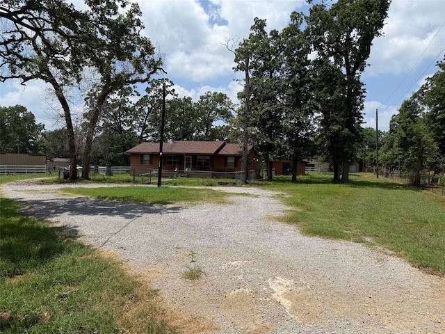 7719 County Road 233, Centerville, TX 75833 - single story home with gravel driveway
