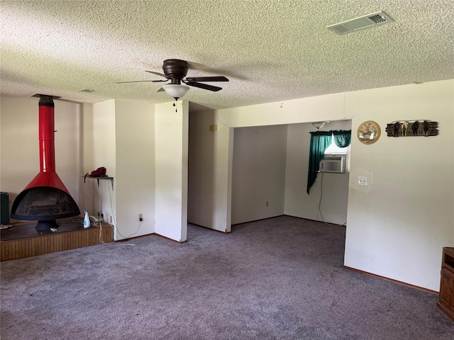 7719 County Road 233, Centerville, TX 75833 - unfurnished living room featuring carpet floors, ceiling fan, a textured ceiling, and baseboards