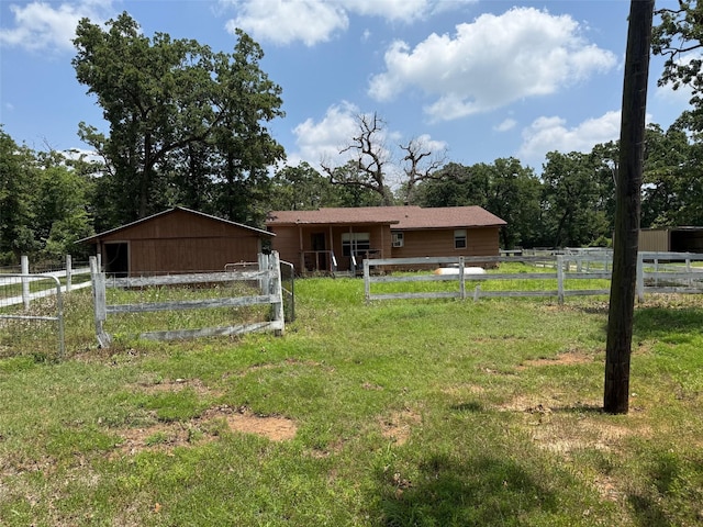 7719 County Road 233, Centerville, TX 75833 - view of front of house with an exterior structure and an outbuilding