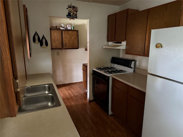 7719 County Road 233, Centerville, TX 75833 - kitchen with freestanding refrigerator, gas stove, under cabinet range hood, and light countertops