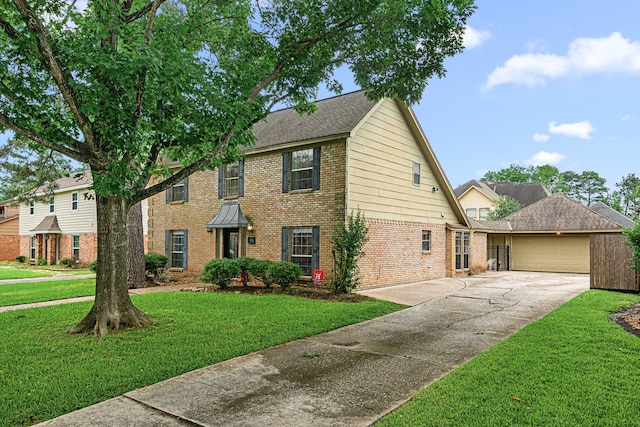 8023 Litchfield Ln, Spring, TX 77379 - view of front facade featuring brick siding, an attached garage, driveway, and a front yard