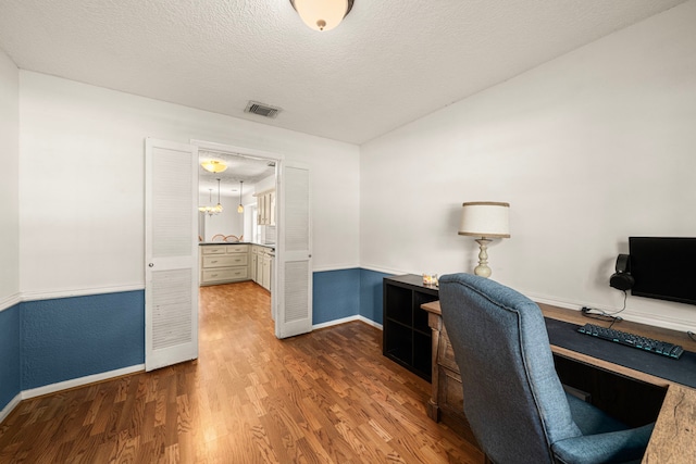 8023 Litchfield Ln, Spring, TX 77379 - office space featuring wood finished floors, baseboards, and a textured ceiling