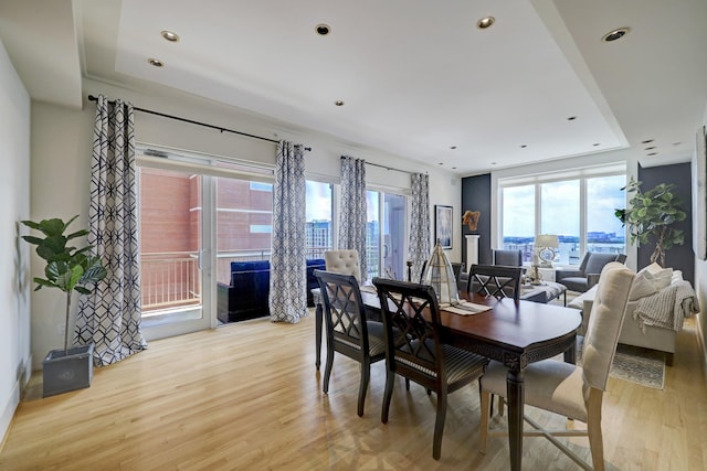 2520 Robinhood St Unit 1012, Houston, TX 77005 - dining area featuring a raised ceiling, plenty of natural light, light wood-style flooring, and recessed lighting