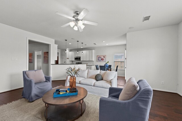 7427 Pony Crk, Missouri City, TX 77459 - living room featuring a ceiling fan, baseboards, dark wood-type flooring, and recessed lighting