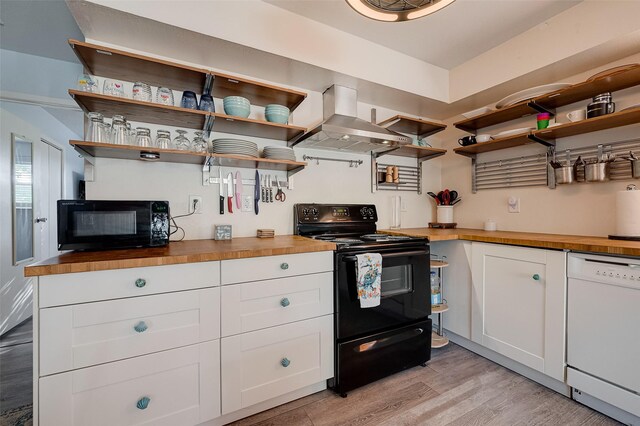 1717 22nd St, Galveston, TX 77550 - kitchen featuring black appliances, open shelves, and butcher block counters
