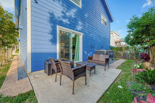 1717 22nd St, Galveston, TX 77550 - fenced backyard featuring a patio area, cooling unit, and an outdoor living space
