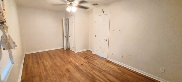 234 Maxie St, Deer Park, TX 77536 - empty room featuring ceiling fan, wood finished floors, and baseboards