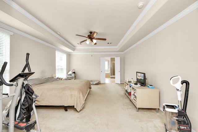 3922 Crestwind Ln, Richmond, TX 77407 - bedroom with a tray ceiling, crown molding, light carpet, a ceiling fan, and baseboards