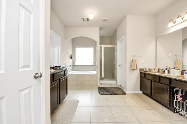 3922 Crestwind Ln, Richmond, TX 77407 - full bathroom featuring vanity, tile patterned floors, a garden tub, and a shower stall