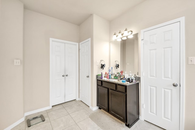 3922 Crestwind Ln, Richmond, TX 77407 - bathroom featuring vanity, baseboards, and tile patterned floors