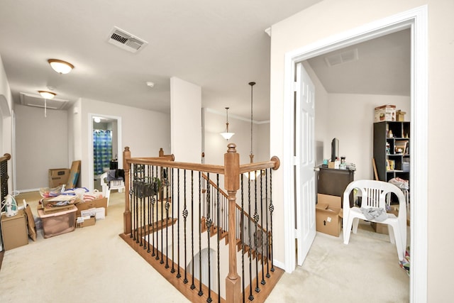 3922 Crestwind Ln, Richmond, TX 77407 - hallway with an upstairs landing, attic access, light colored carpet, and baseboards