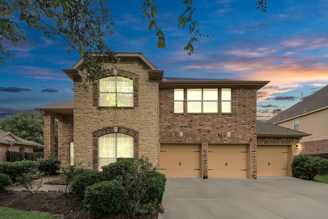 3922 Crestwind Ln, Richmond, TX 77407 - view of front facade with driveway, stone siding, a shingled roof, and brick siding