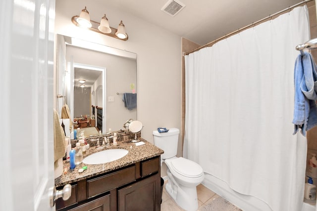 3922 Crestwind Ln, Richmond, TX 77407 - bathroom with tile patterned floors, vanity, and toilet