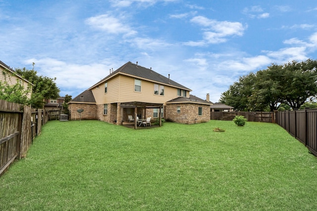 3922 Crestwind Ln, Richmond, TX 77407 - rear view of property featuring brick siding, central AC unit, and a patio