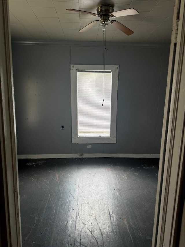 4204 Wipprecht St, Houston, TX 77026 - empty room with baseboards, a ceiling fan, ornamental molding, and wood-type flooring