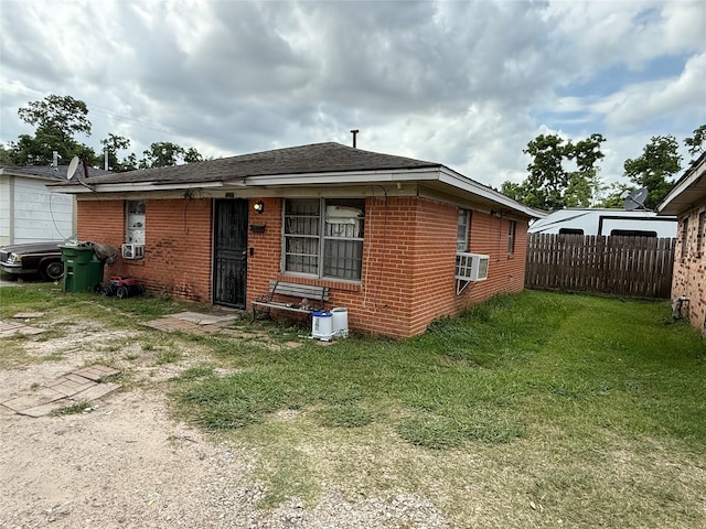 4204 Wipprecht St, Houston, TX 77026 - back of house with brick siding and cooling unit