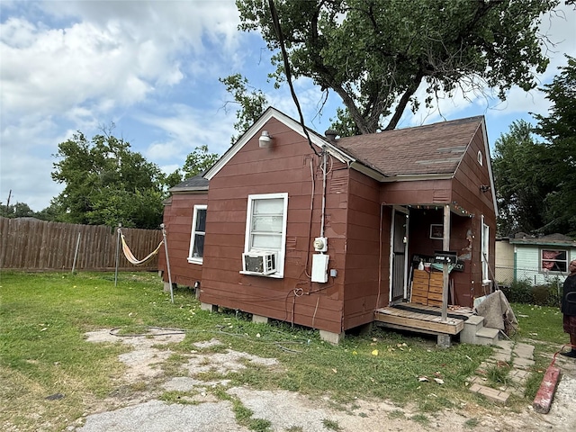 4204 Wipprecht St, Houston, TX 77026 - view of side of home featuring a shingled roof and cooling unit