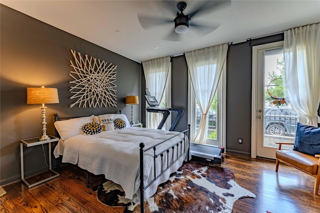 242 E 28th St, Houston, TX 77008 - bedroom featuring wood finished floors, access to exterior, baseboards, and ceiling fan