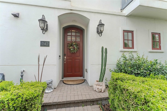 242 E 28th St, Houston, TX 77008 - doorway to property featuring stucco siding