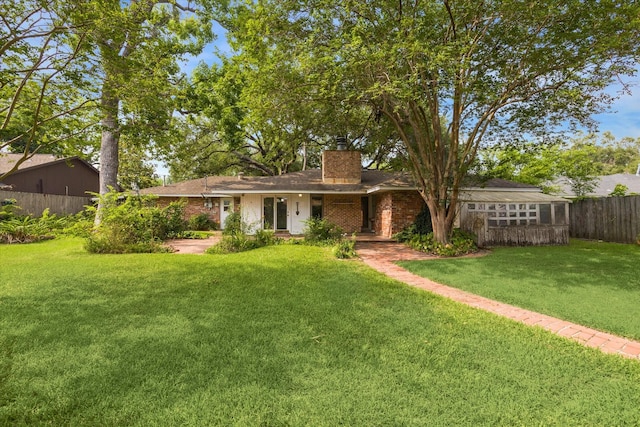 8721 Greiner Dr, Houston, TX 77080 - rear view of property featuring a chimney and brick siding