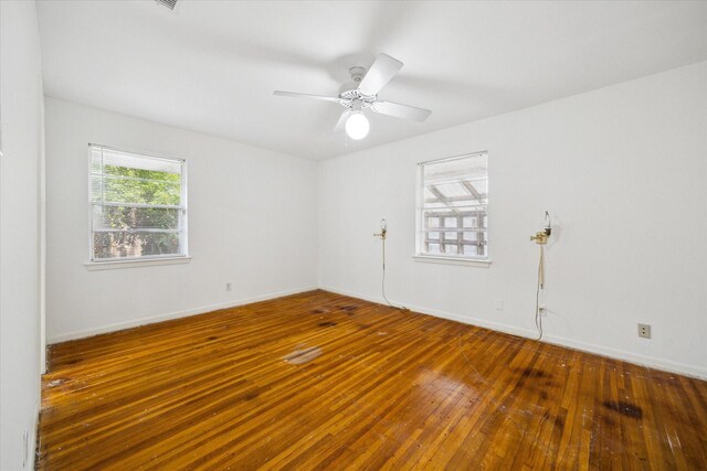8721 Greiner Dr, Houston, TX 77080 - empty room featuring wood-type flooring, ceiling fan, and baseboards