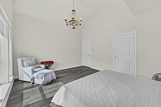 16819 Talisker Dr, Richmond, TX 77407 - bedroom with a chandelier, dark wood-style flooring, high vaulted ceiling, and baseboards