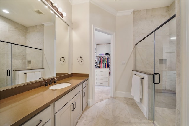 2314 Red Fox Dr, Missouri City, TX 77459 - bathroom featuring marble finish floors, vanity, crown molding, a spacious closet, and a shower stall