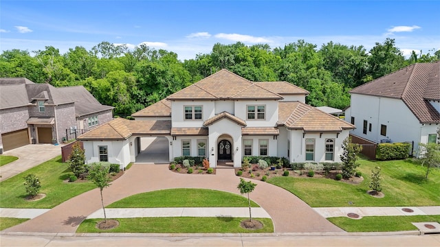 2314 Red Fox Dr, Missouri City, TX 77459 - view of front of property featuring stucco siding, a front yard, a tile roof, and concrete driveway