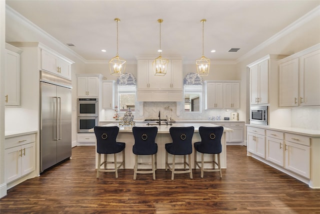 2314 Red Fox Dr, Missouri City, TX 77459 - kitchen with built in appliances, recessed lighting, tasteful backsplash, dark wood-type flooring, and white cabinetry